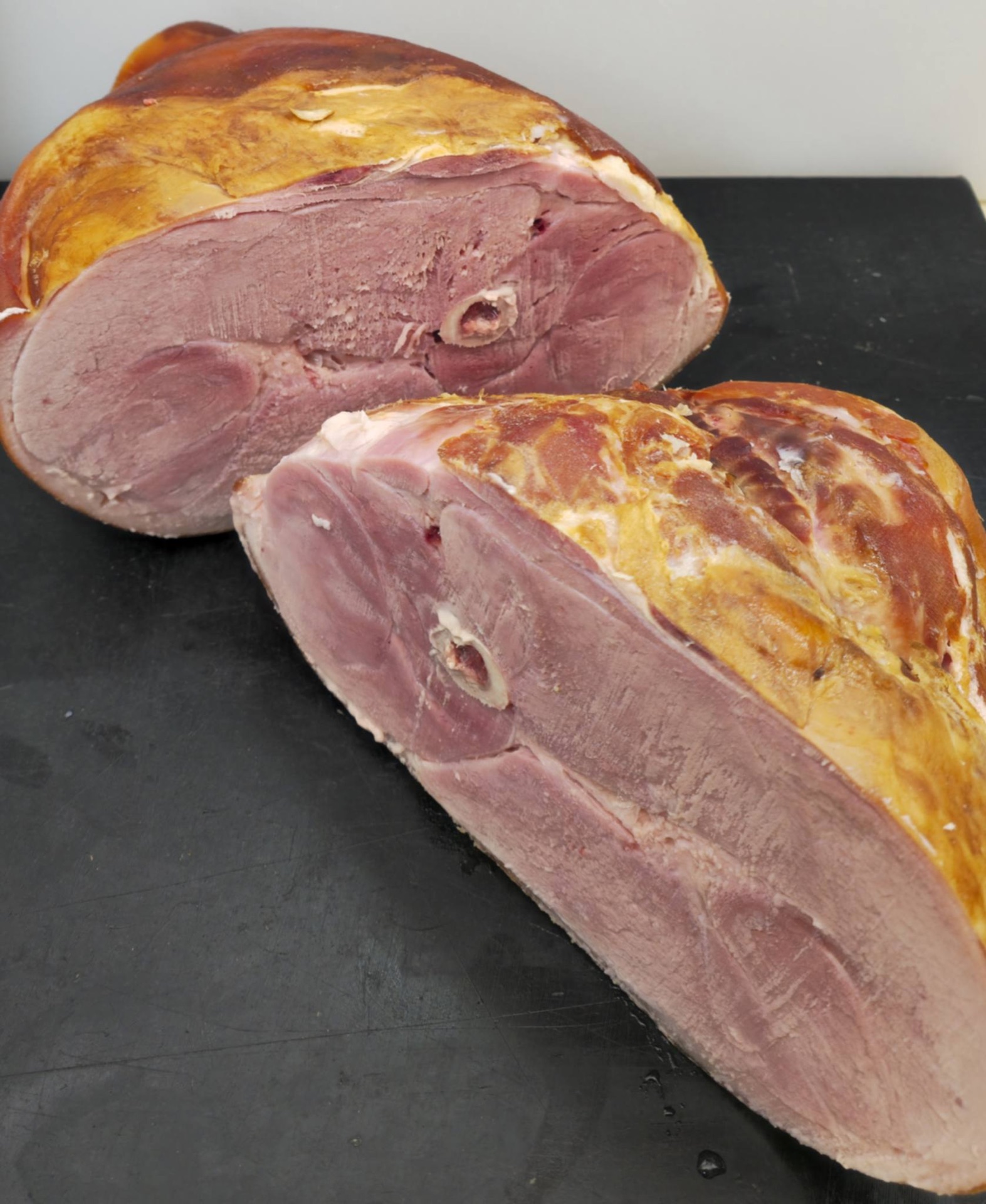 A whole cured ham made in store at De Bauchery